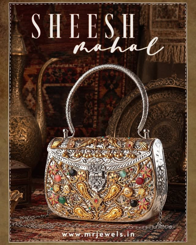 A piece that feels like it belongs inside a palace corridor ✨Handcrafted with intricate meenakari details, antique silver tones, golden accents, and jewel-like colours, this Sheesh Mahal bag is made for the woman who loves statement luxury.For weddings, festive nights, and every royal entrance.www.mrjewels.in#MRJewels #SheeshMahal #LuxuryBag #HandcraftedLuxury #IndianLuxury #WeddingAccessories #BridalBag #StatementBag #FestiveFashion #RoyalEdit #Meenakari #IndianJewellery #DesignerBag #HeritageLuxury #MRJewelsIndia by @mrjewels100