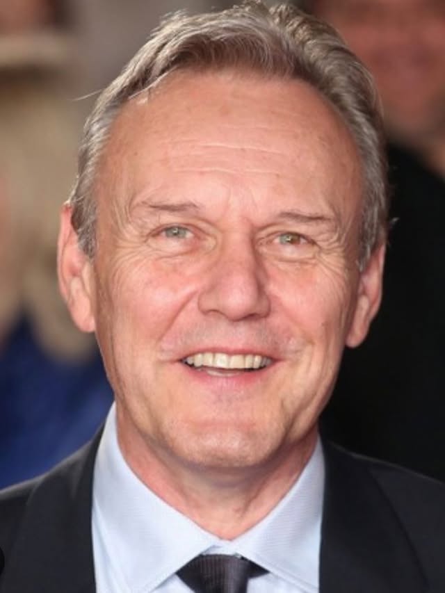 Anthony Head (1954-2026) That’s ridiculously sad, what a lovely man. Oh, he could twinkle. So wise, so kind, so classy. I worked with him on Doctor Who, and on Merlin (I helped with early development on that, I suggested that magic should be illegal) and he was an absolute delight. In Doctor Who, he had a face-off with K9 and had the immortal line, “Forget the shooty dog thing.” Now look, that’s a glorious line, but requires a deep breath for a grown man. I muttered to him quietly, “Do you mind the shooty dog line?” He said, “Mind?! I think it’s wonderful!” And so was he. Also, he spoke always about his daughters with such love and joy, what a wonderful dad. Love and sympathy to Emily, Daisy, family and friends, he’ll be missed and remembered across the world. Good night, sir ♥️